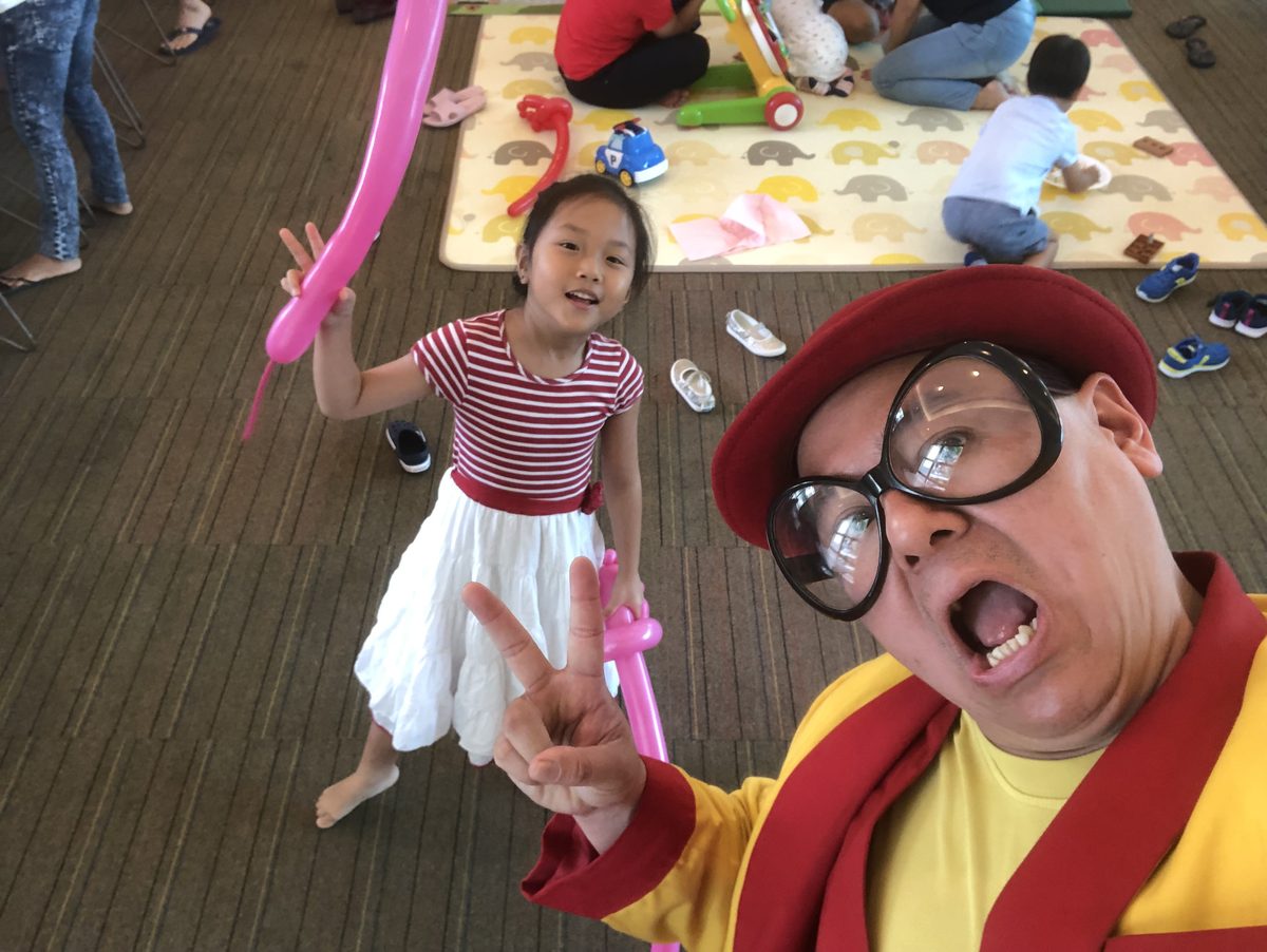 A young guest showing off her balloon sculpture